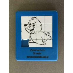 Schuif puzzeltje met reclame zwemschool Shoebi